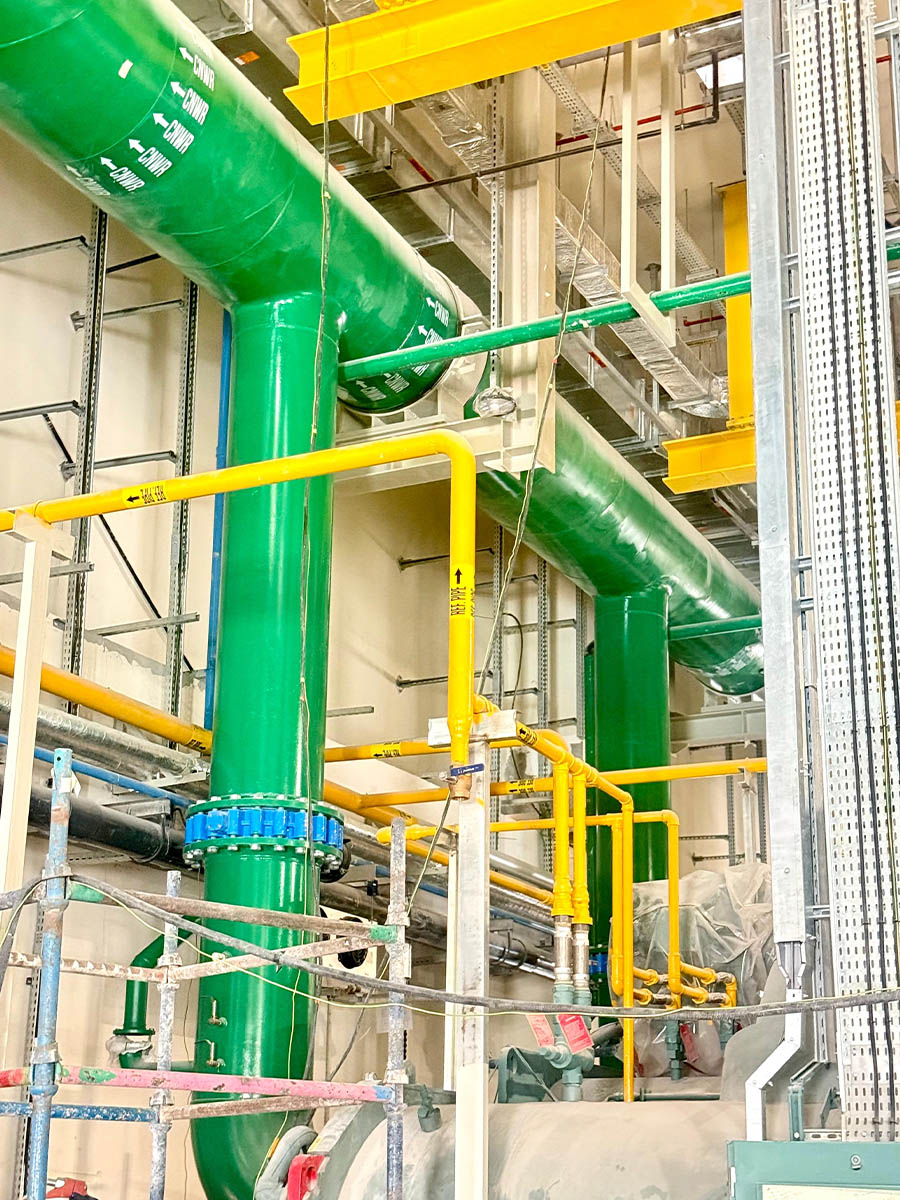 Chilled water piping installation in a commercial plant room